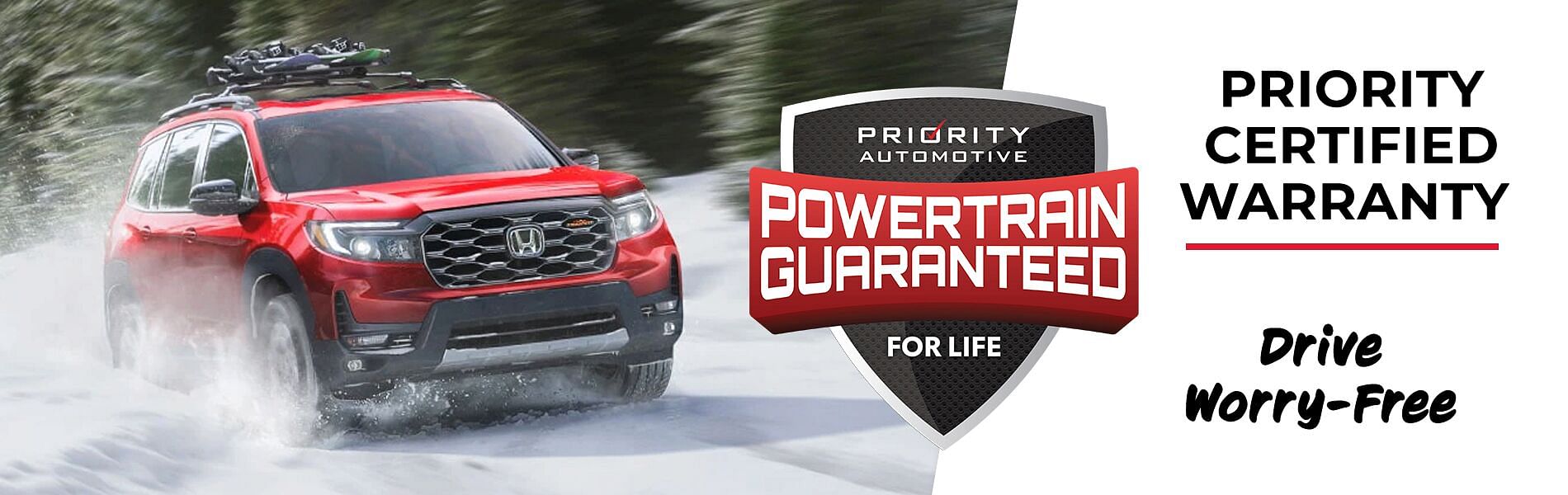 A red honda driving through the snow - Powertrain guaranteed. Priority certified warranty, drive worry-free